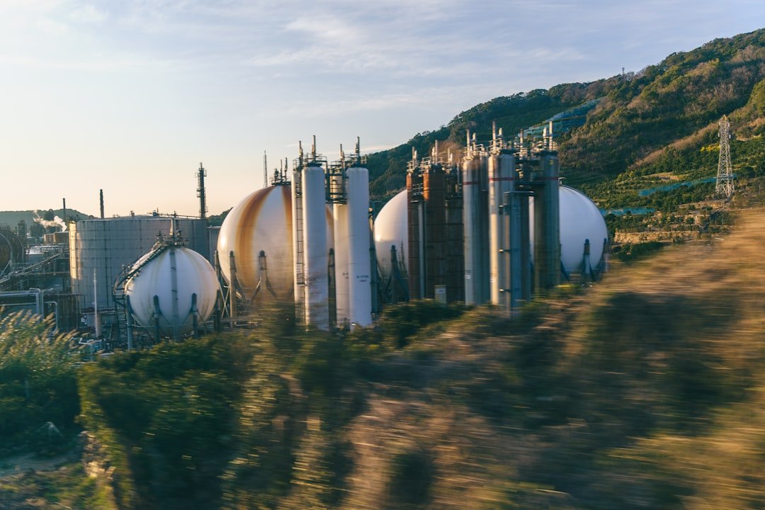 Industrial storage tanks and processing towers illustrating chemical-management infrastructure