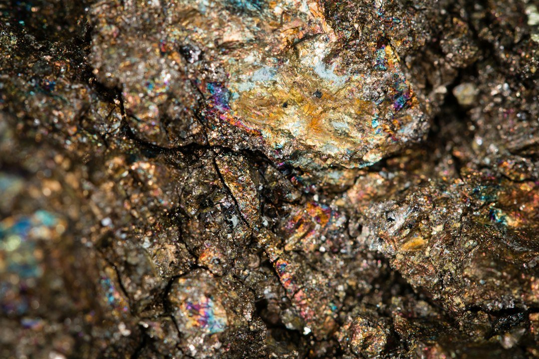 Close-up of a mineral-bearing rock sample used as an illustration for assay quality control