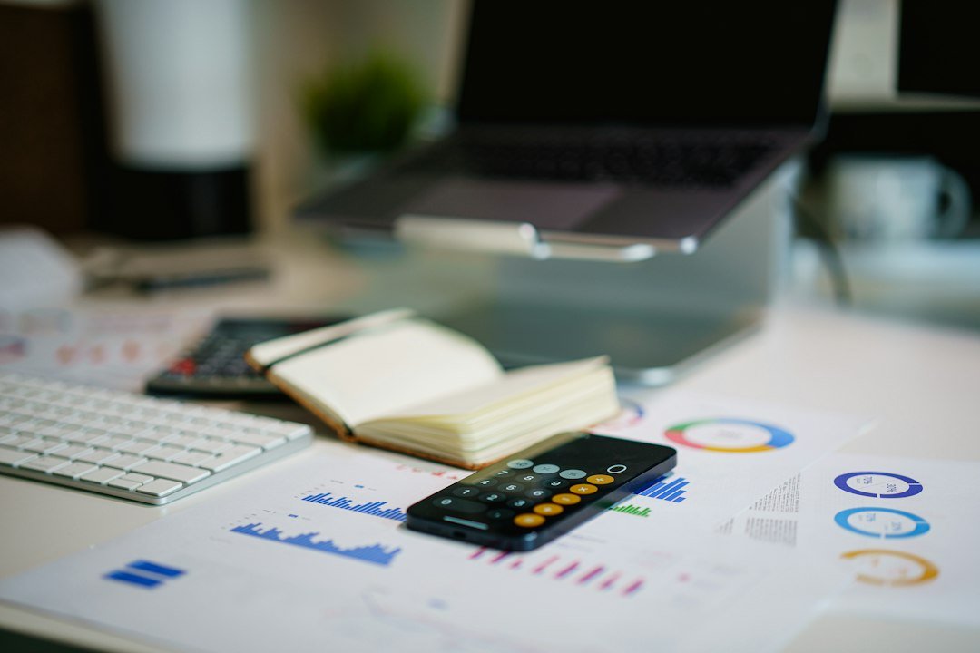 Calculator and financial charts used to illustrate project valuation analysis